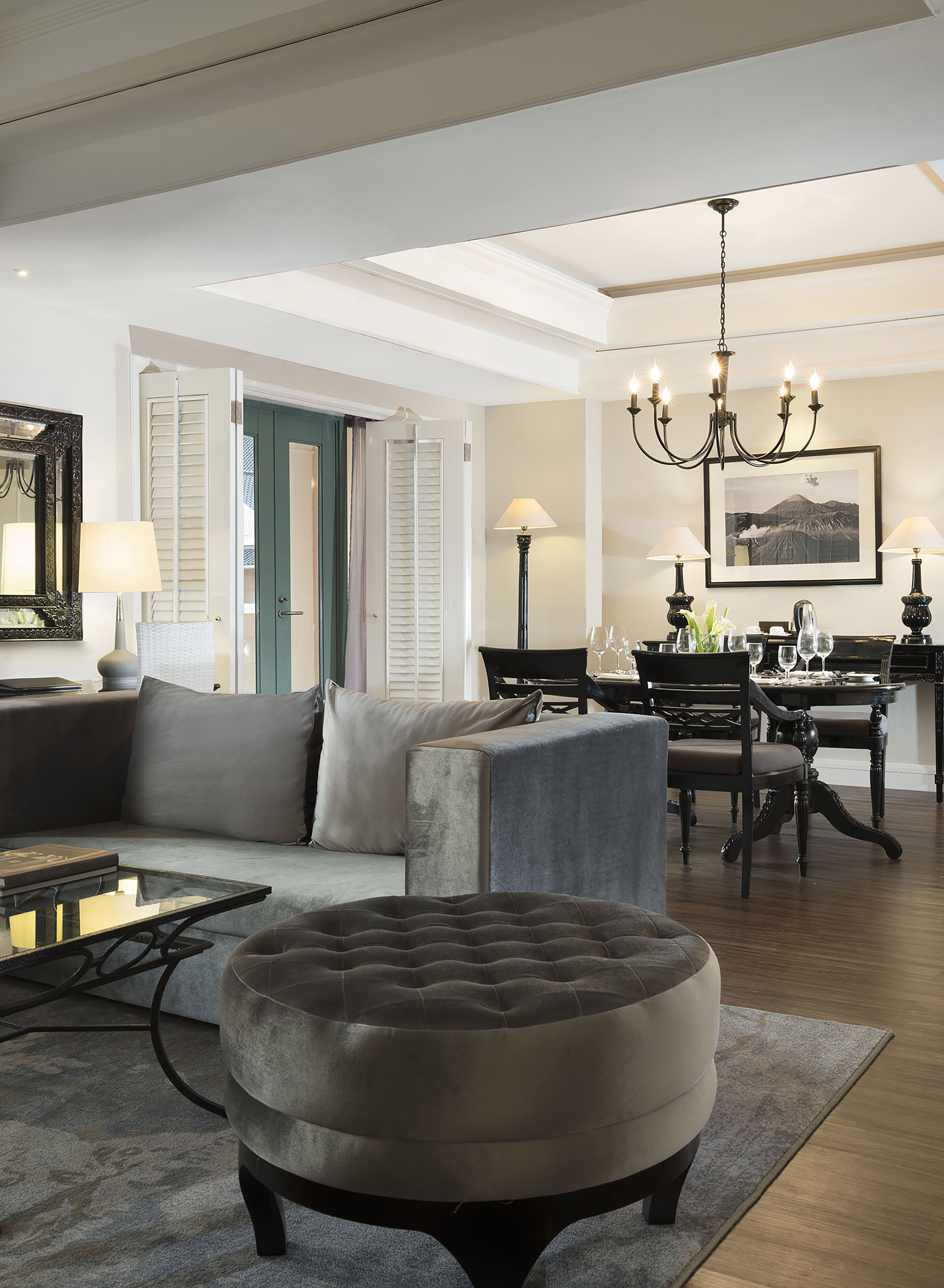 a living room with a couch and dining table