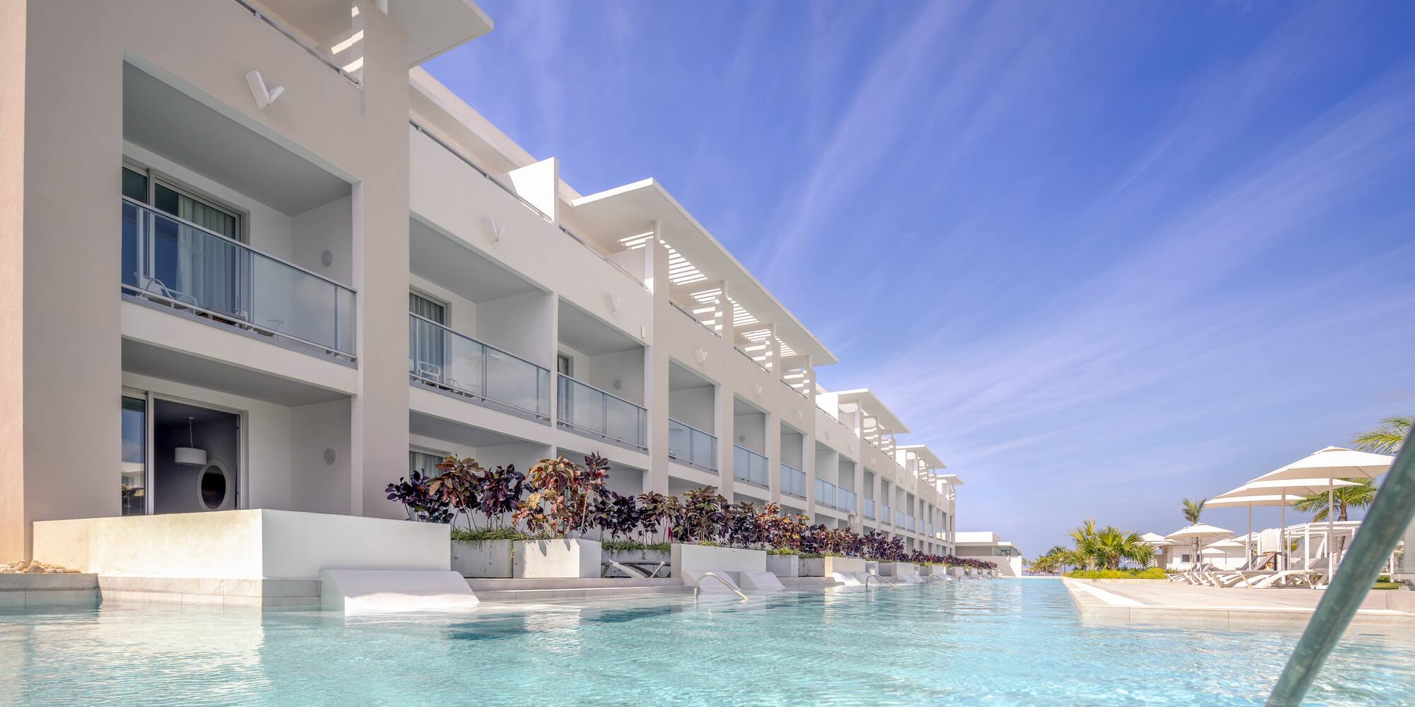 a pool of water with a building in the background