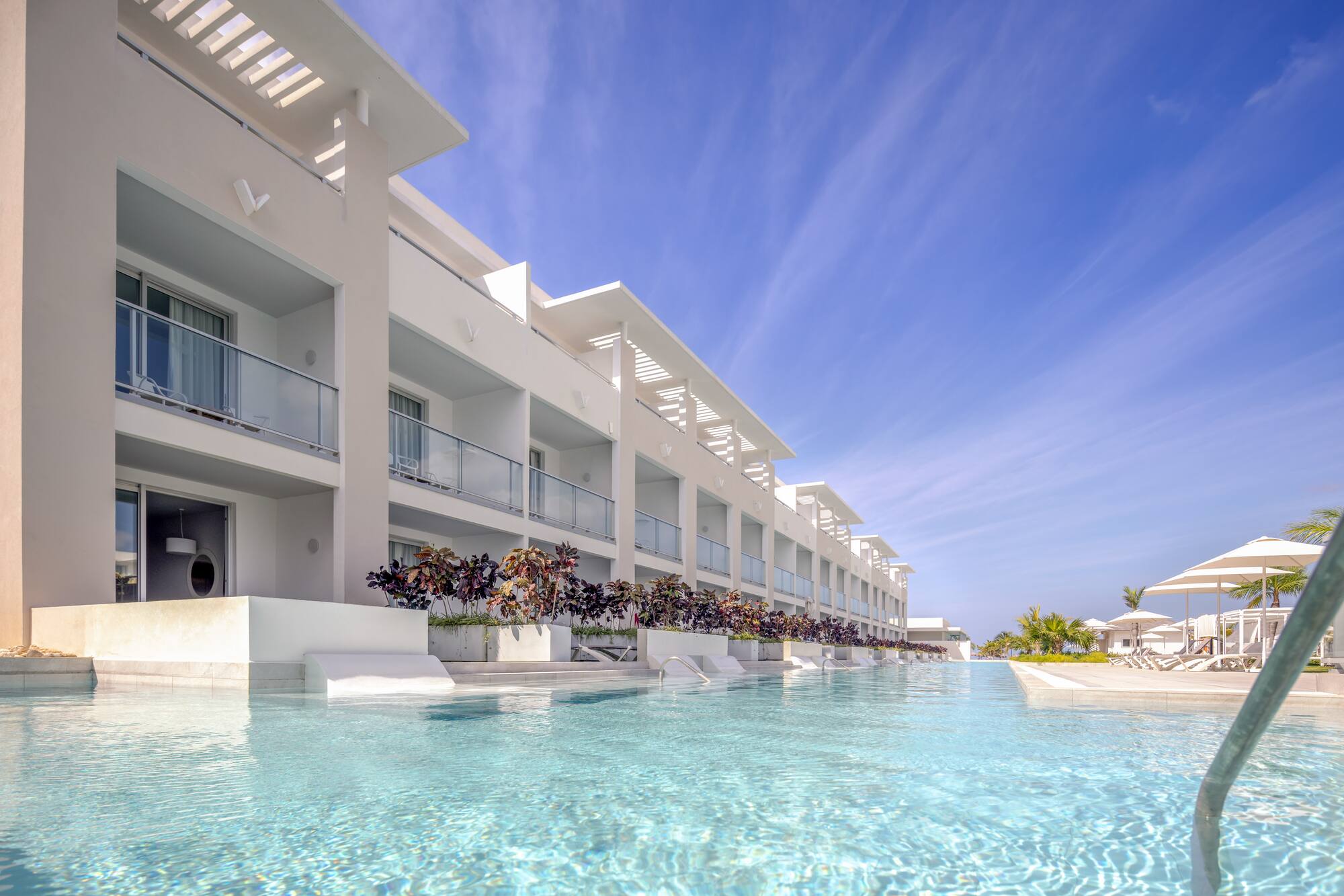 a pool of water with a building in the background
