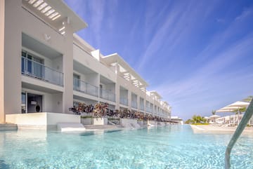 a pool of water with a building in the background