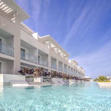 a pool of water with a building in the background