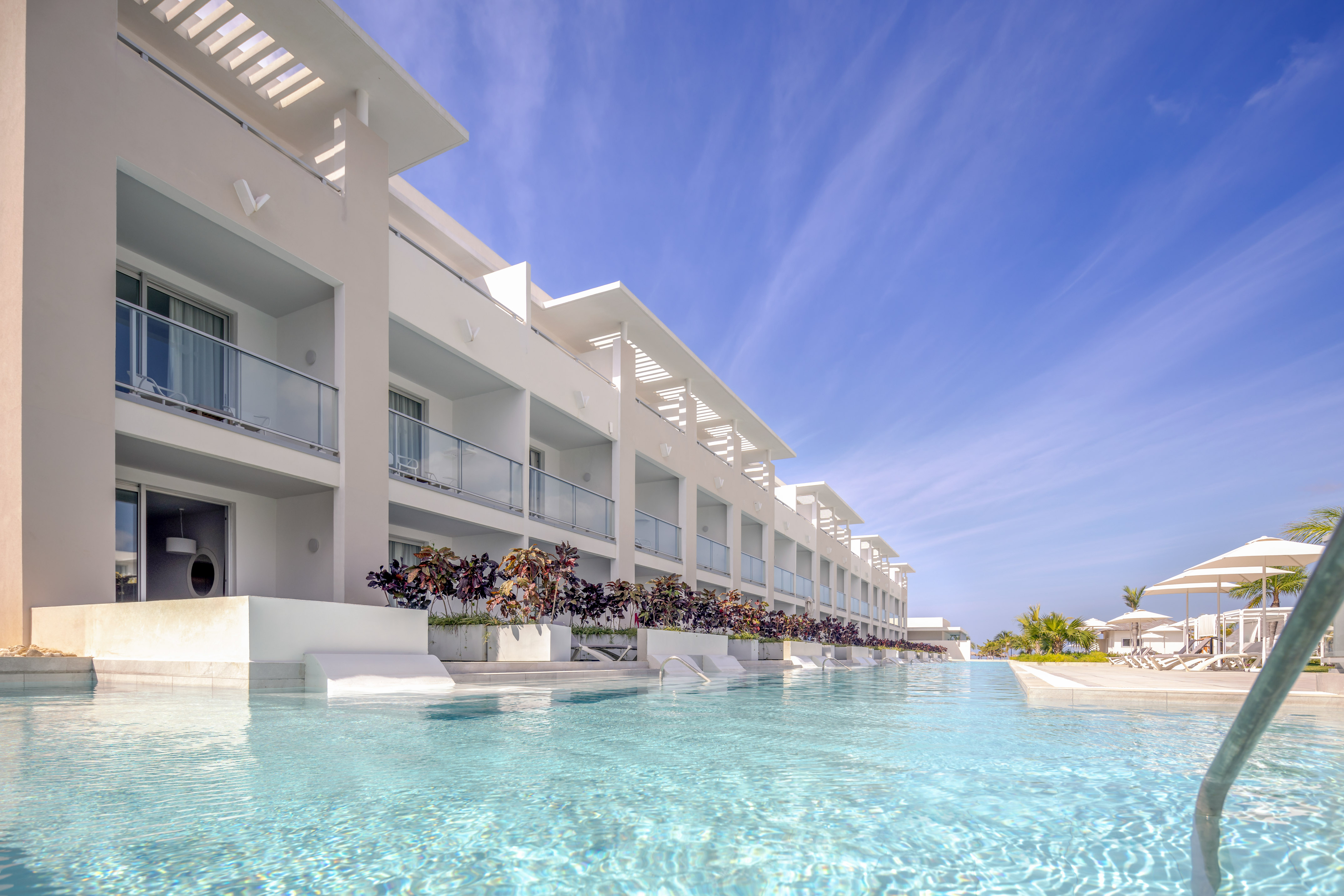 a pool of water with a building in the background