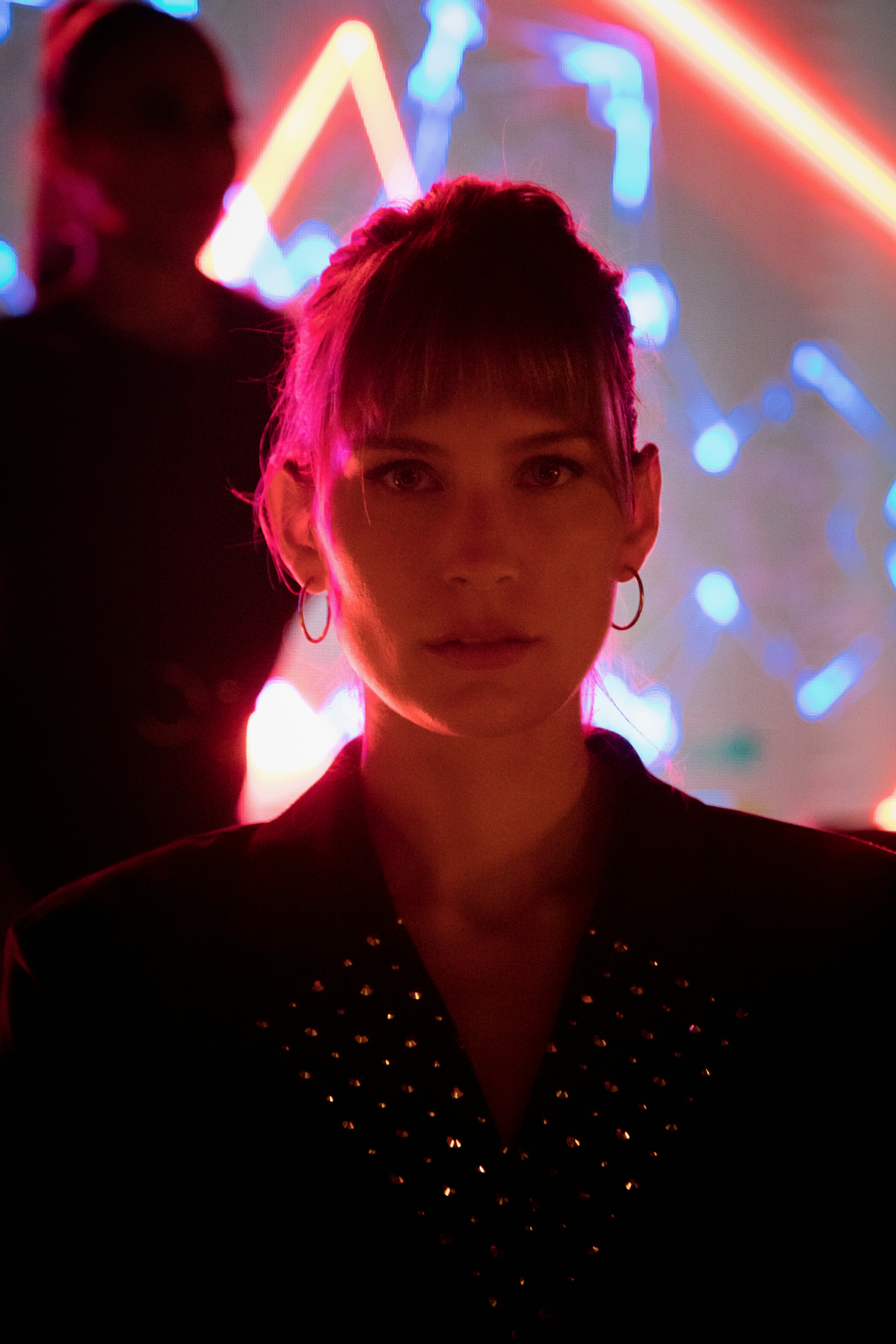 a woman in a dark room