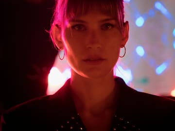 a woman in a dark room