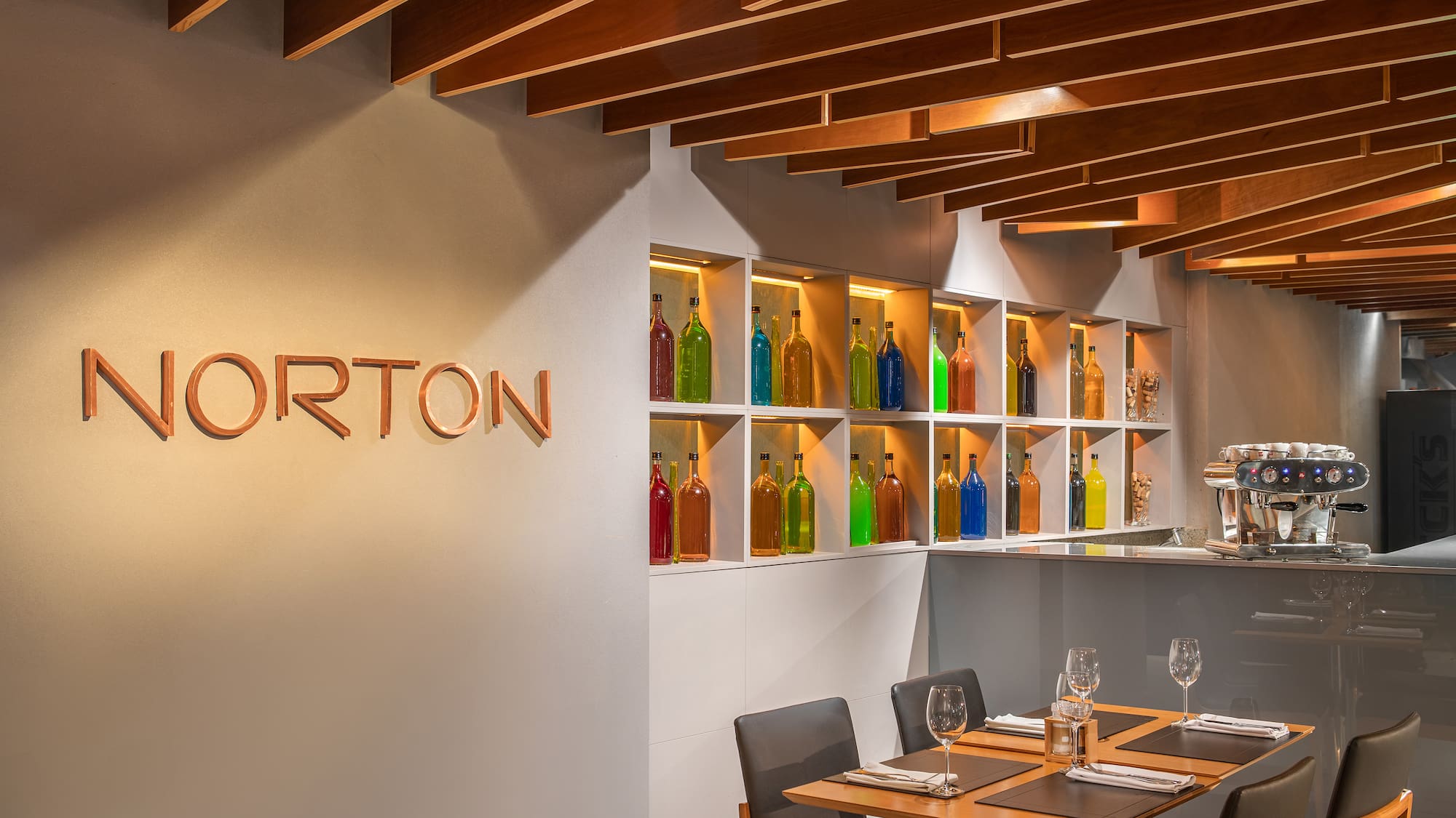 a restaurant with a table and chairs