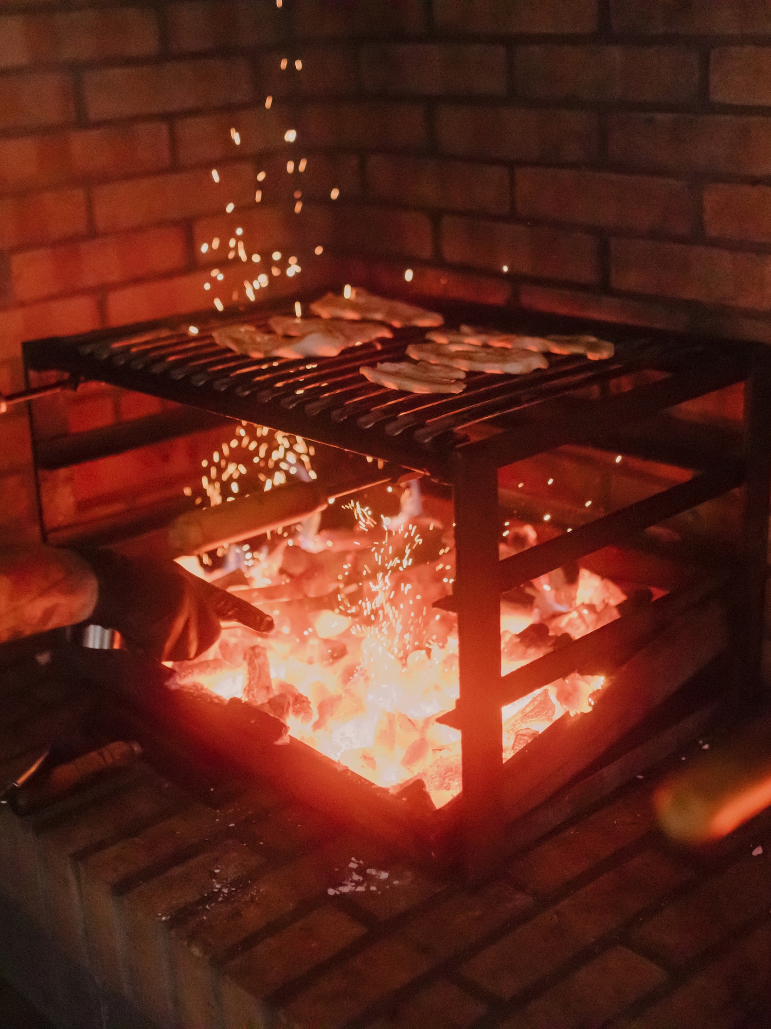 a person cooking food in a grill
