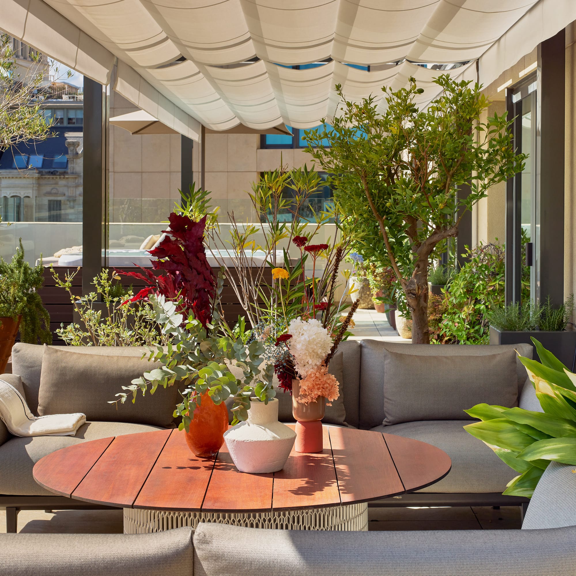 a patio with a table and chairs