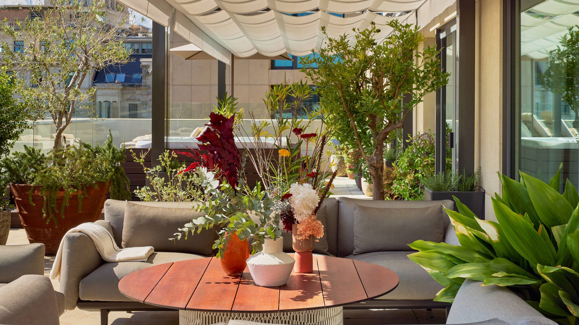 a patio with a table and chairs