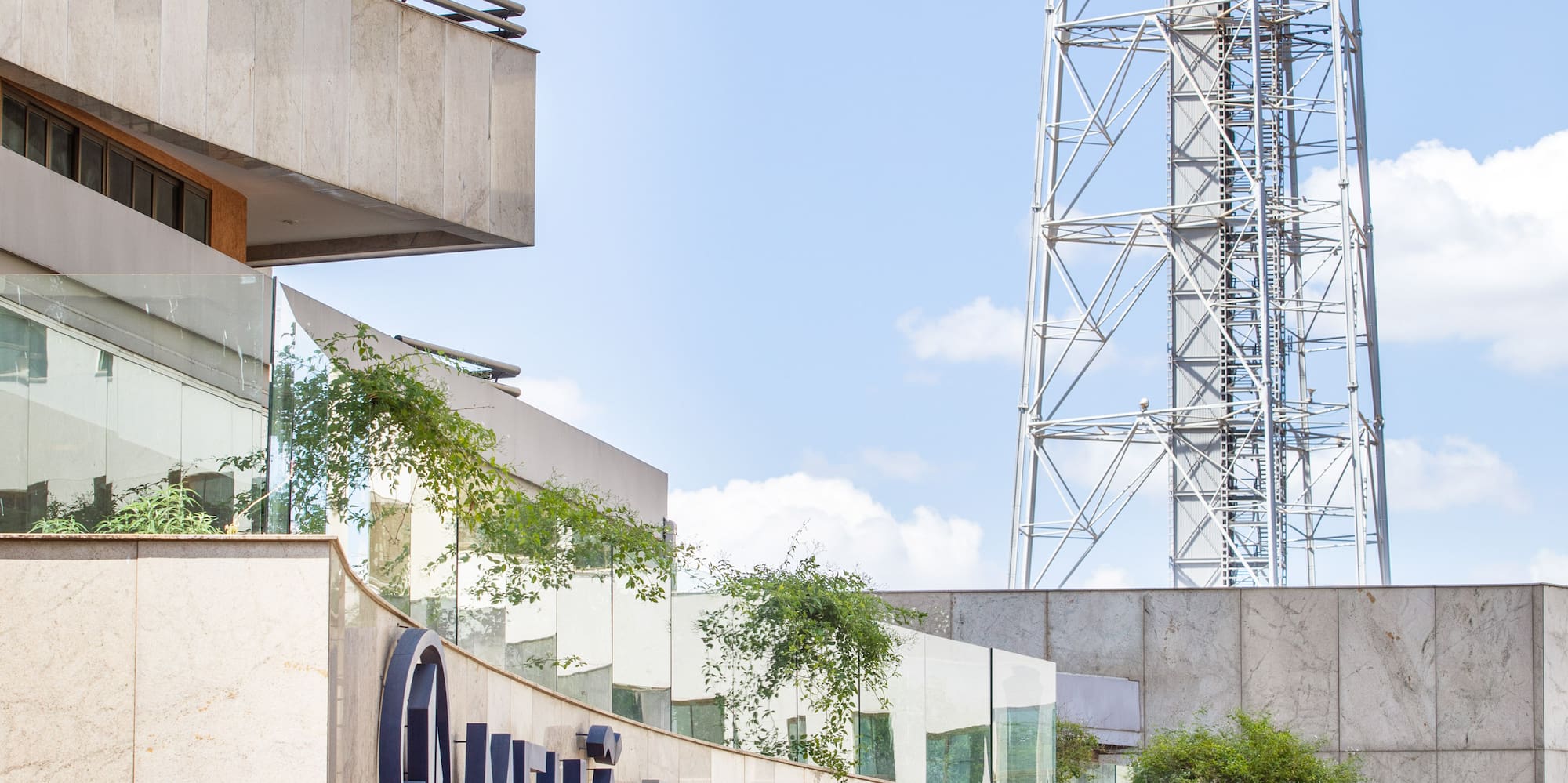 a building with a tower in the background