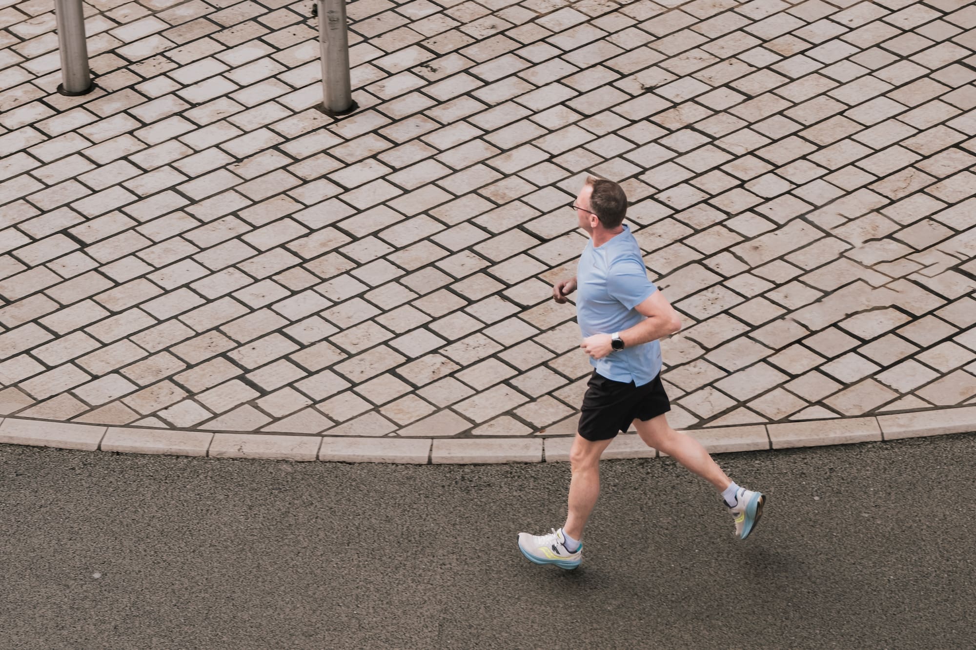 a man running on a brick road