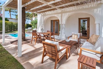 a patio with a table and chairs