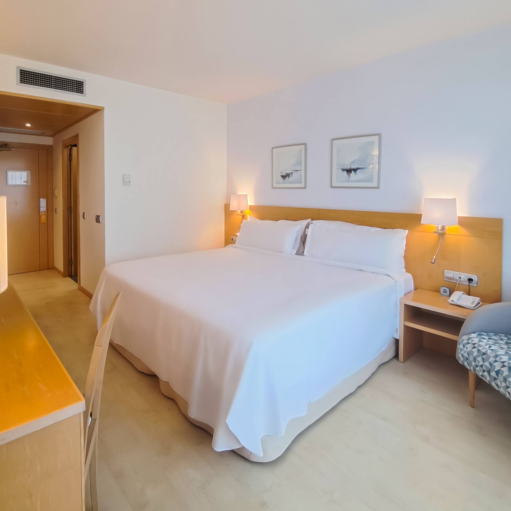 a room with a bed and a chair