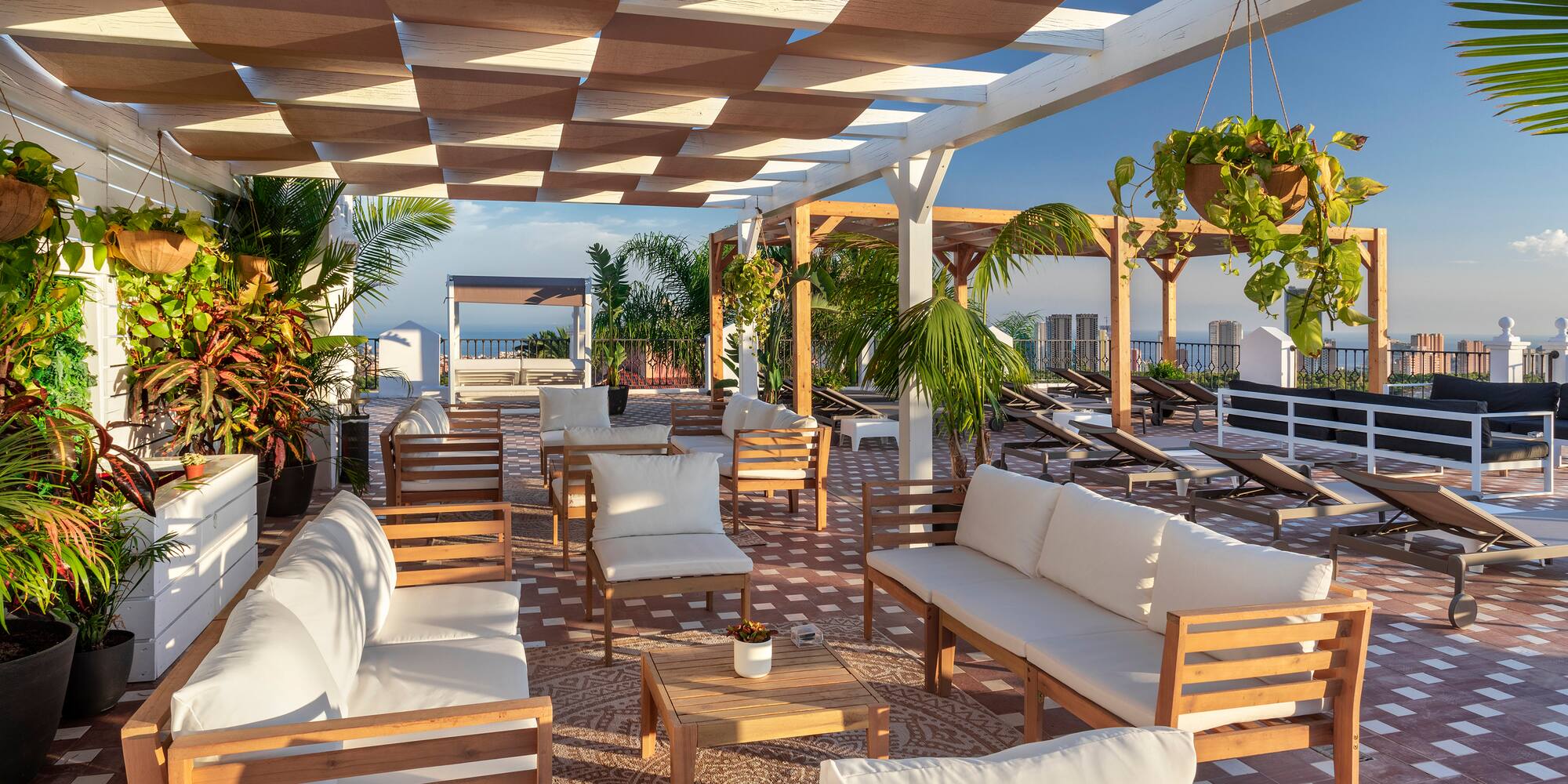 a patio with white furniture and chairs