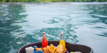 a basket with food on it in water