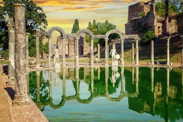 a pool of water with a statue in the middle