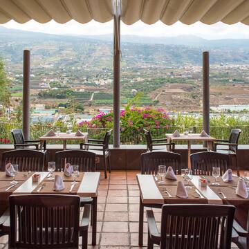a restaurant with tables and chairs