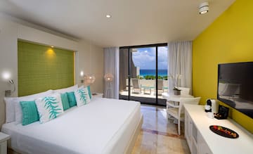 a room with a bed and a glass door