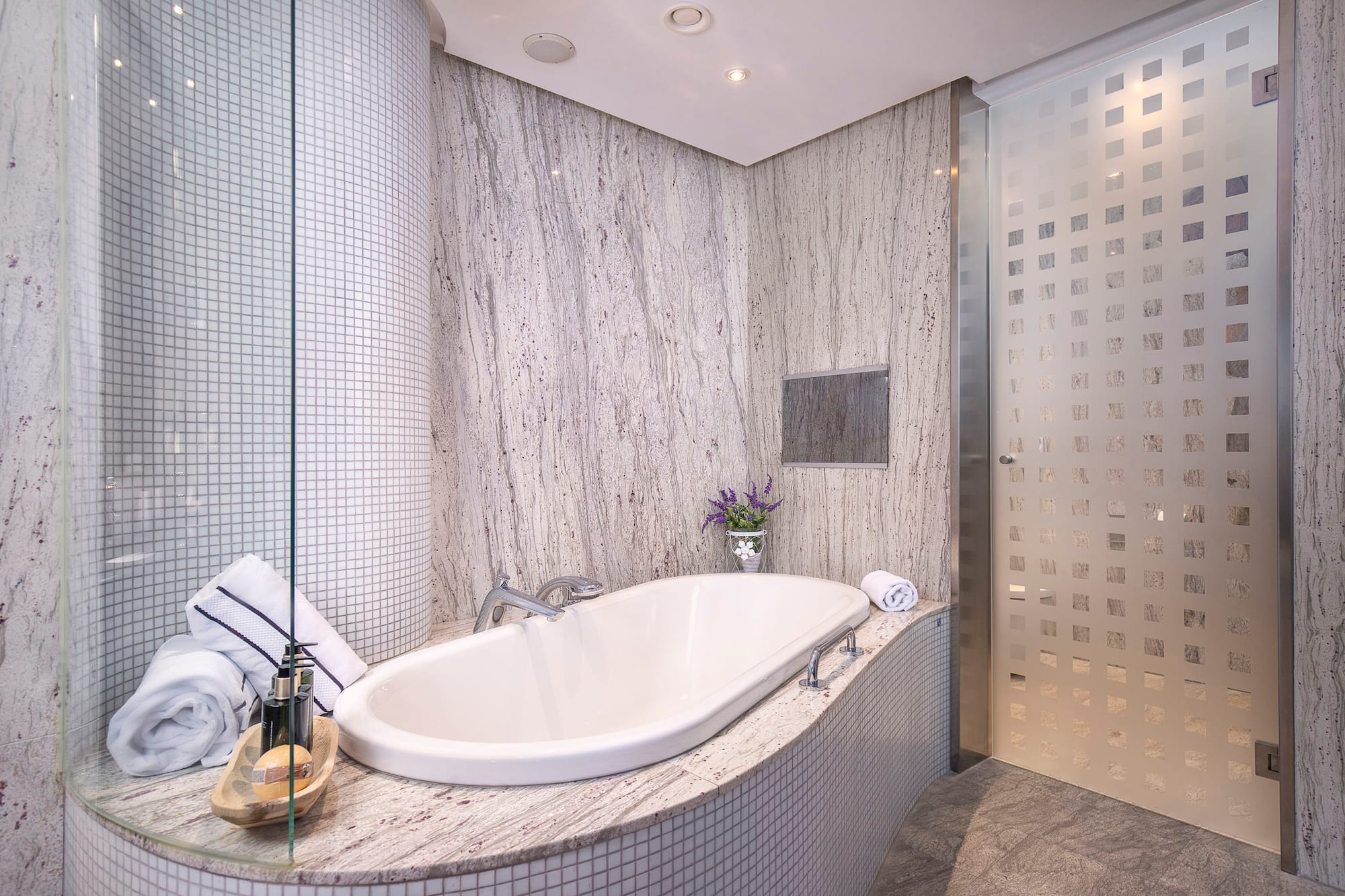 a bathroom with a tub and shower