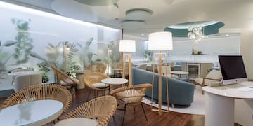 a room with chairs and tables