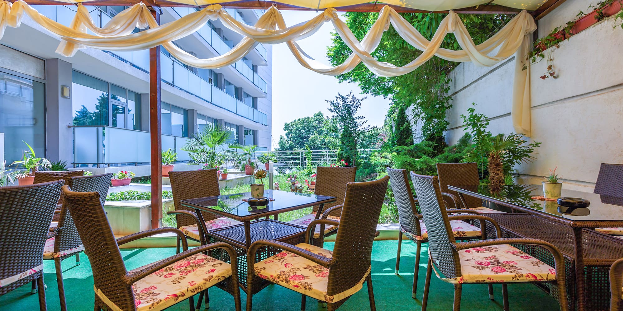 a patio area with chairs and tables