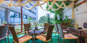 a patio area with chairs and tables