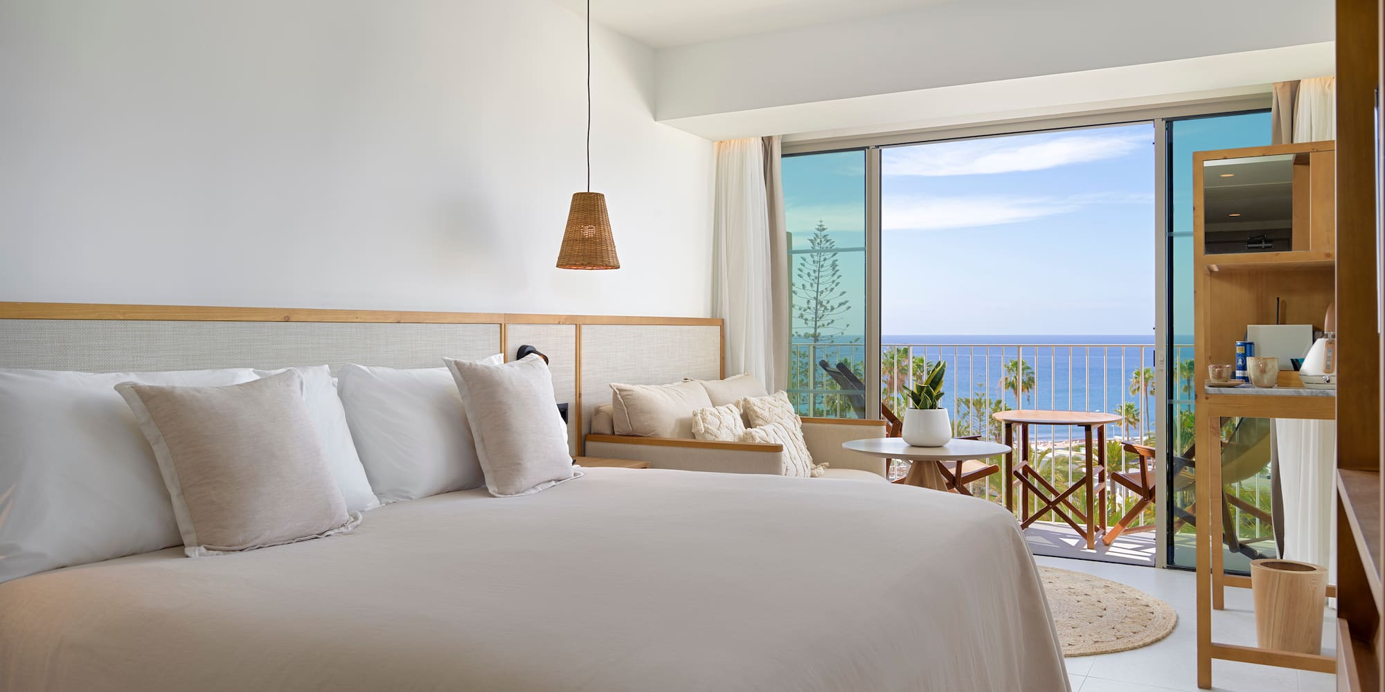 a bedroom with a large bed and a large window