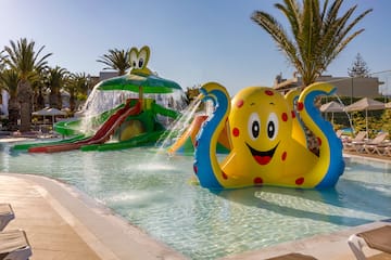 a water park with an inflatable octopus and a slide