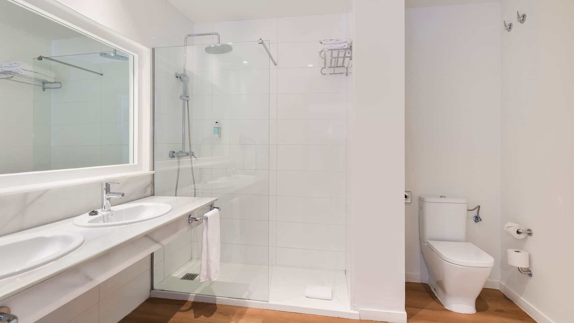 a bathroom with a shower and toilet