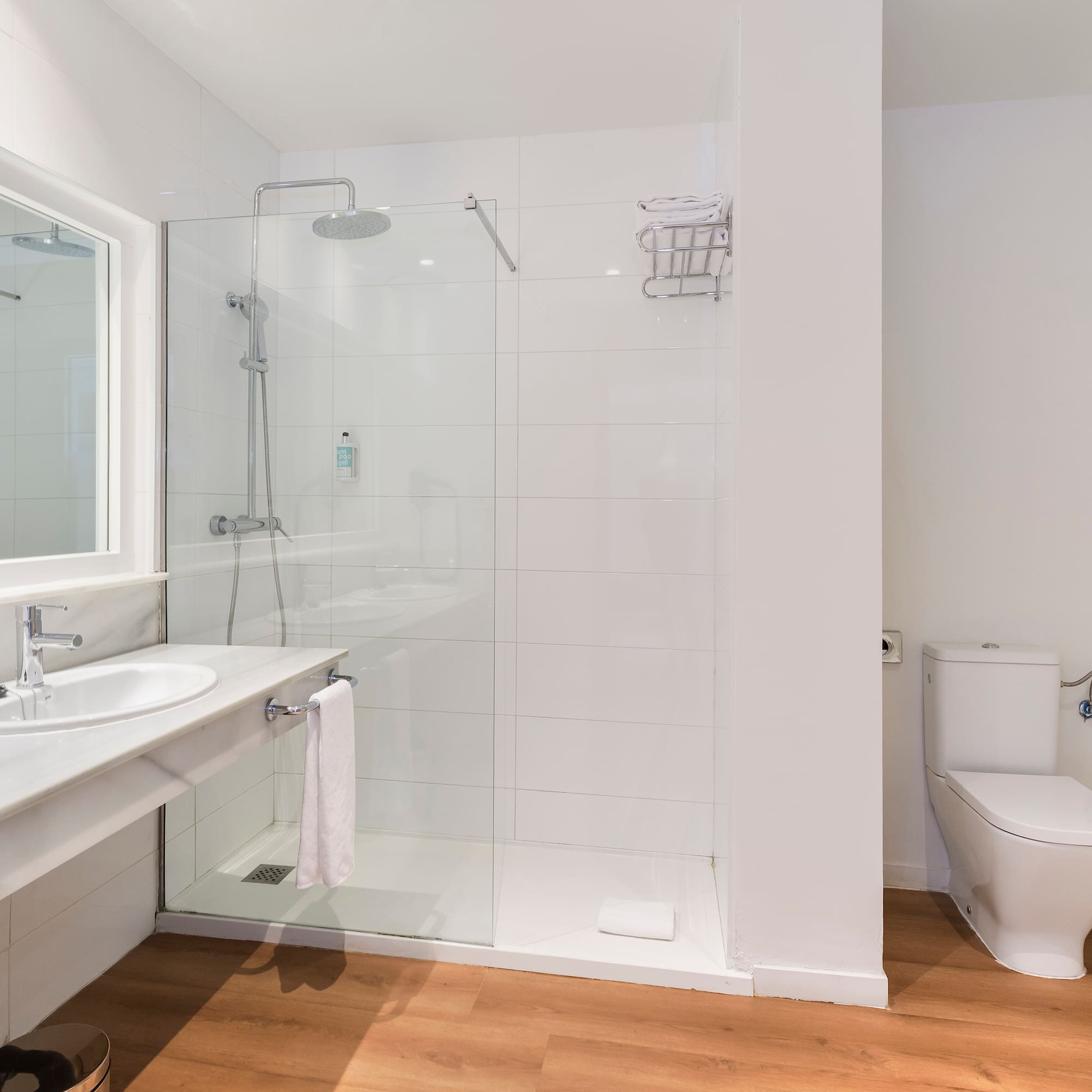 a bathroom with a shower and toilet