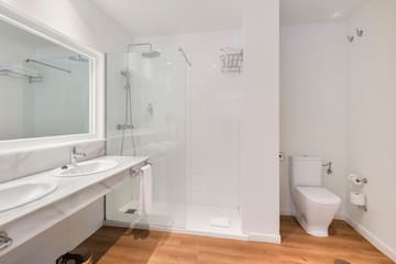 a bathroom with a shower and toilet