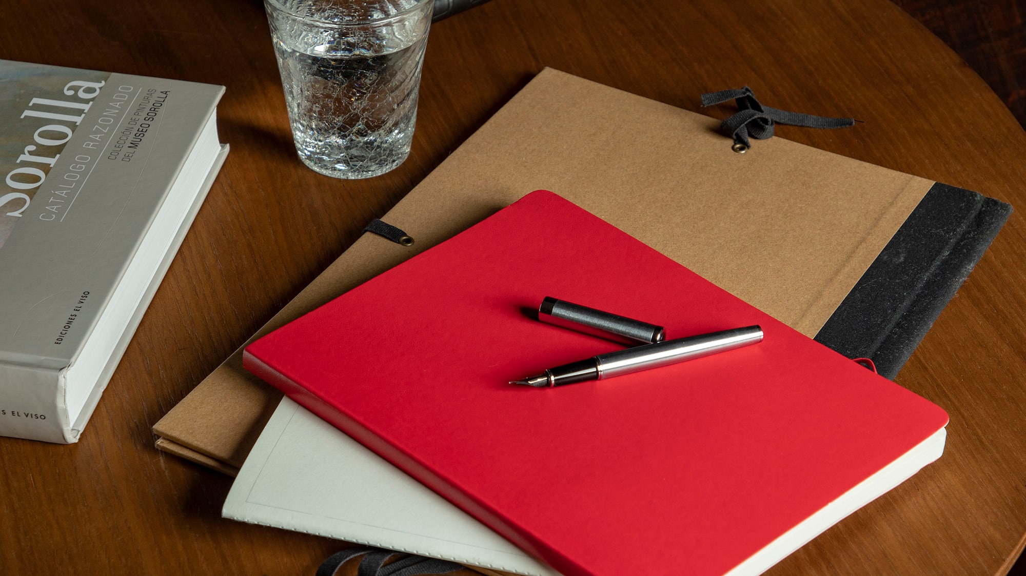 a table with a cup of coffee and books