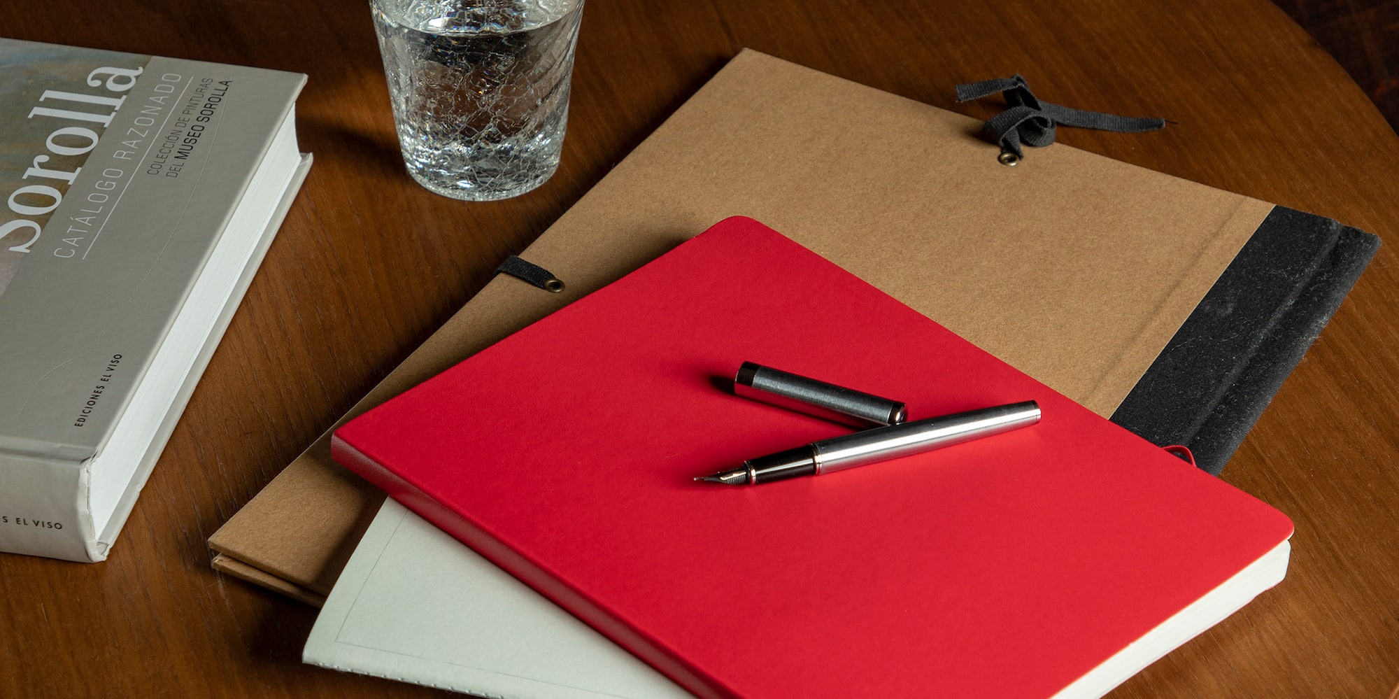 a table with a cup of coffee and books