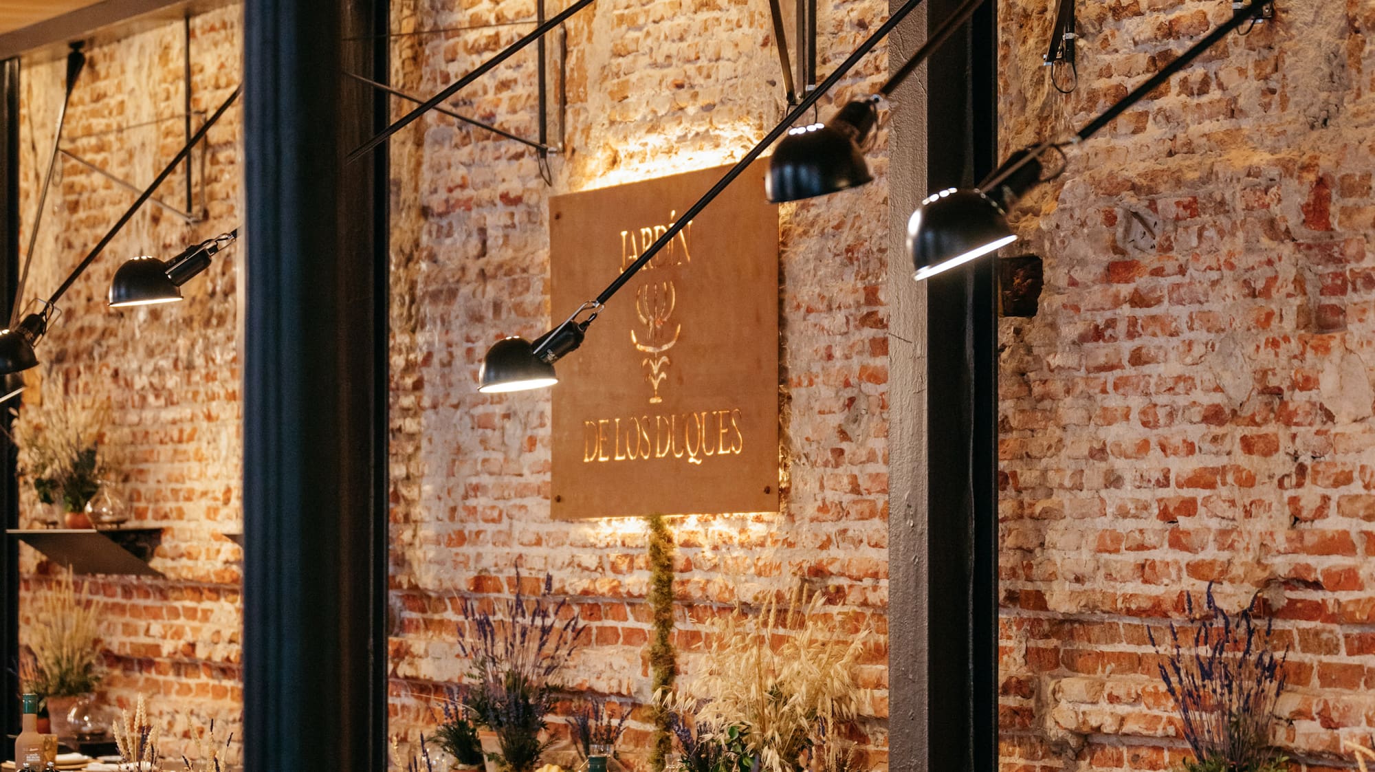 a restaurant with brick walls and tables