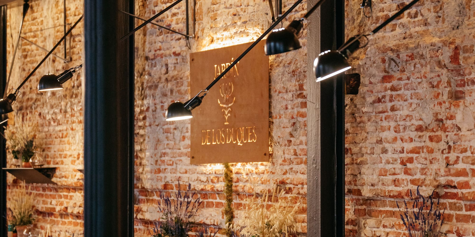 a restaurant with brick walls and tables