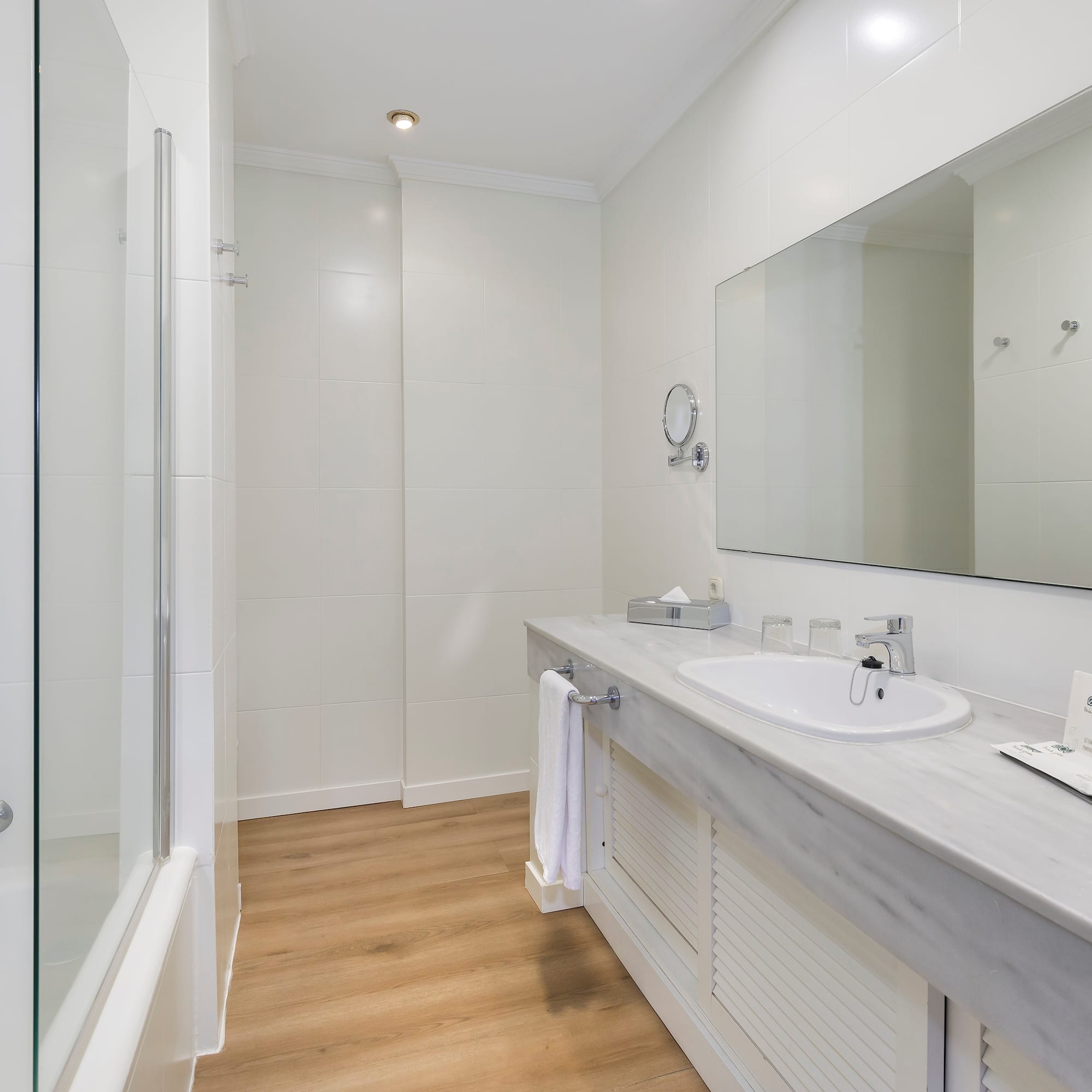 a bathroom with a mirror and sink
