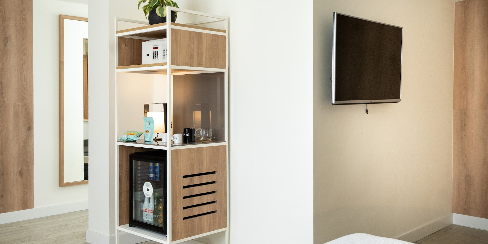 a shelf with a tv on the wall