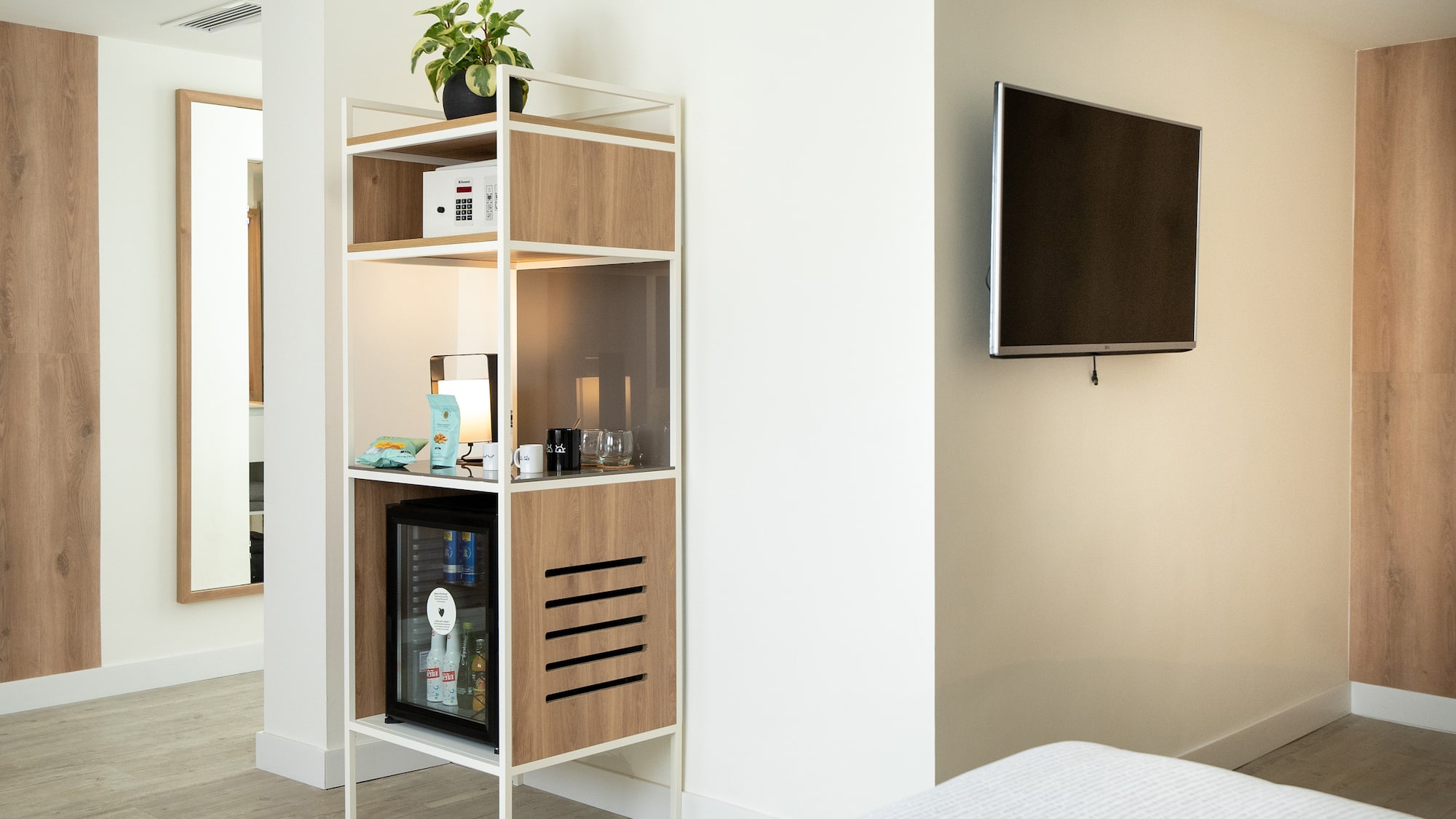 a shelf with a tv on the wall