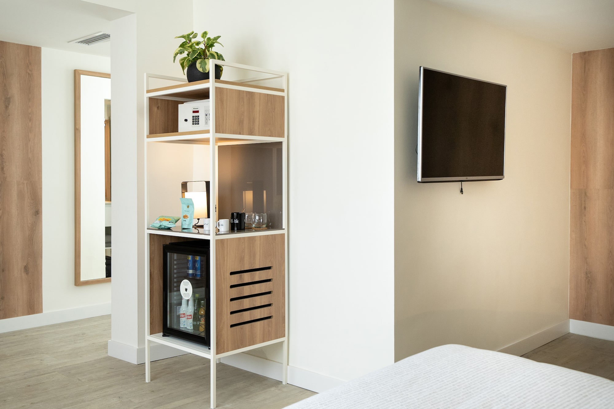 a shelf with a tv on the wall