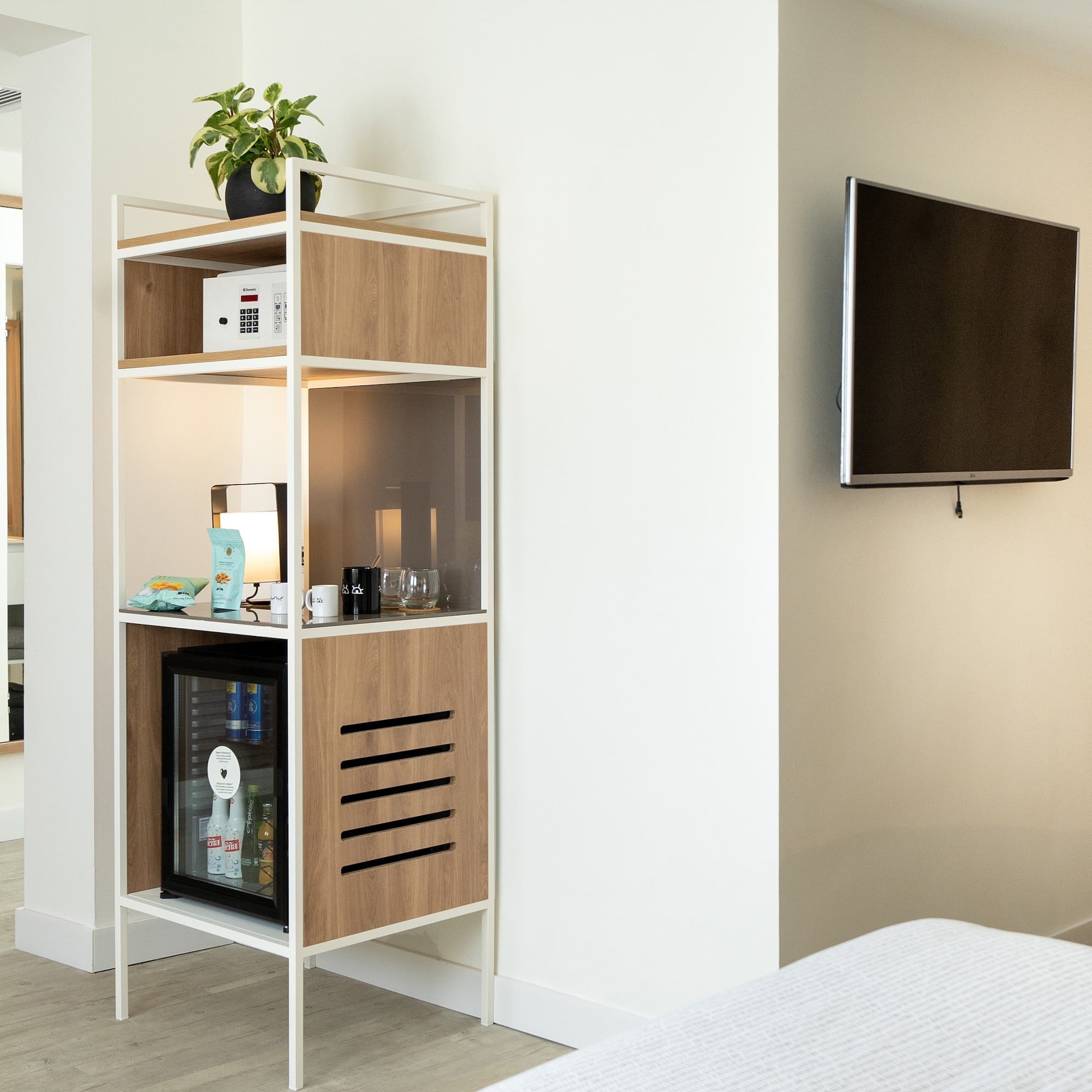 a shelf with a tv on the wall