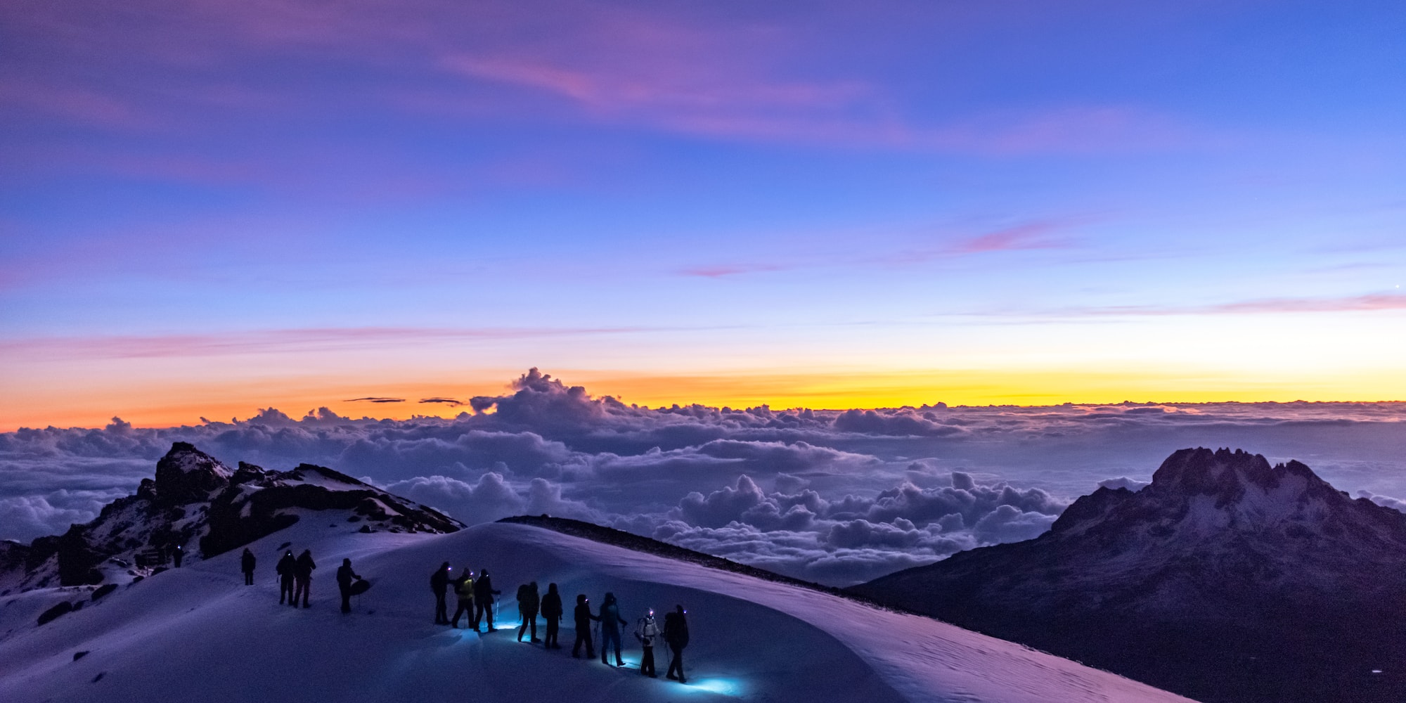 a group of people on a snowy mountain