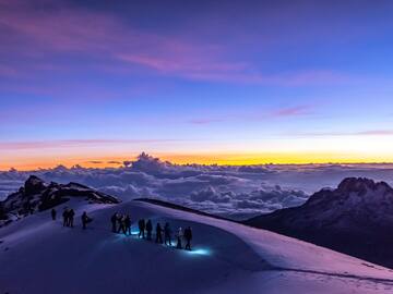 a group of people on a snowy mountain