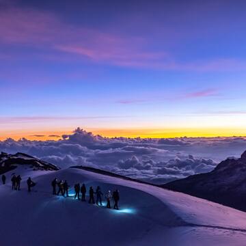a group of people on a snowy mountain
