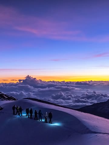 a group of people on a snowy mountain