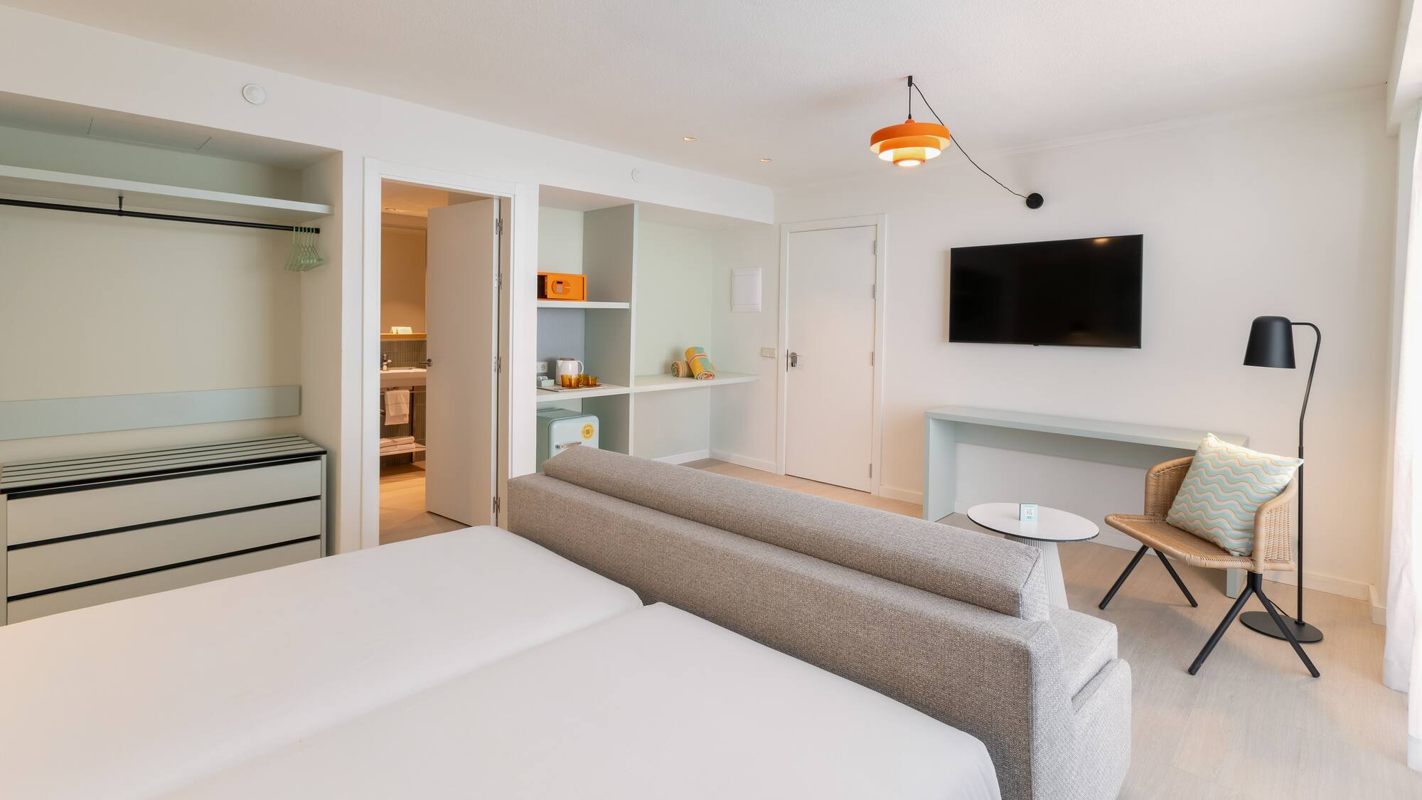 a room with a tv and a couch