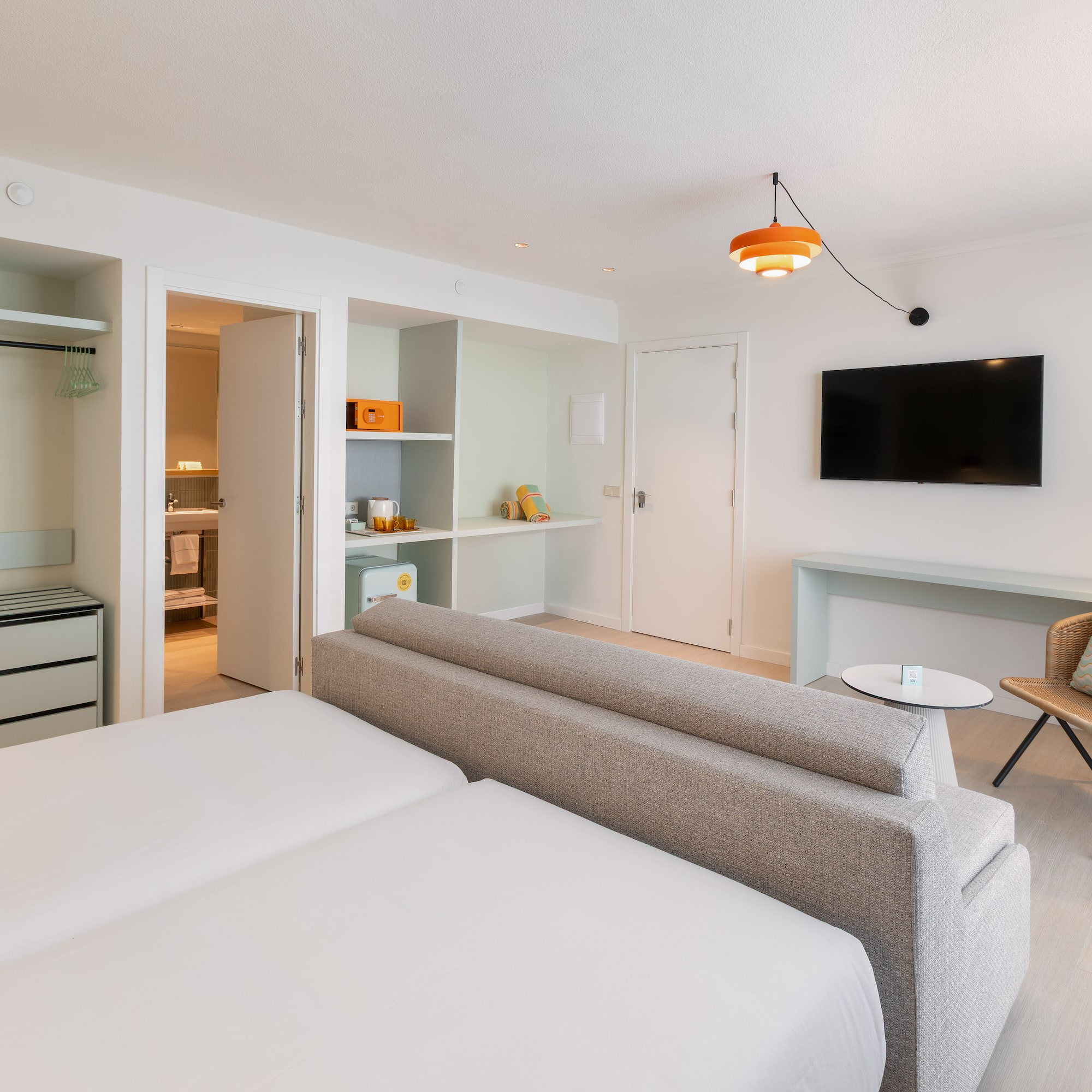 a room with a tv and a couch