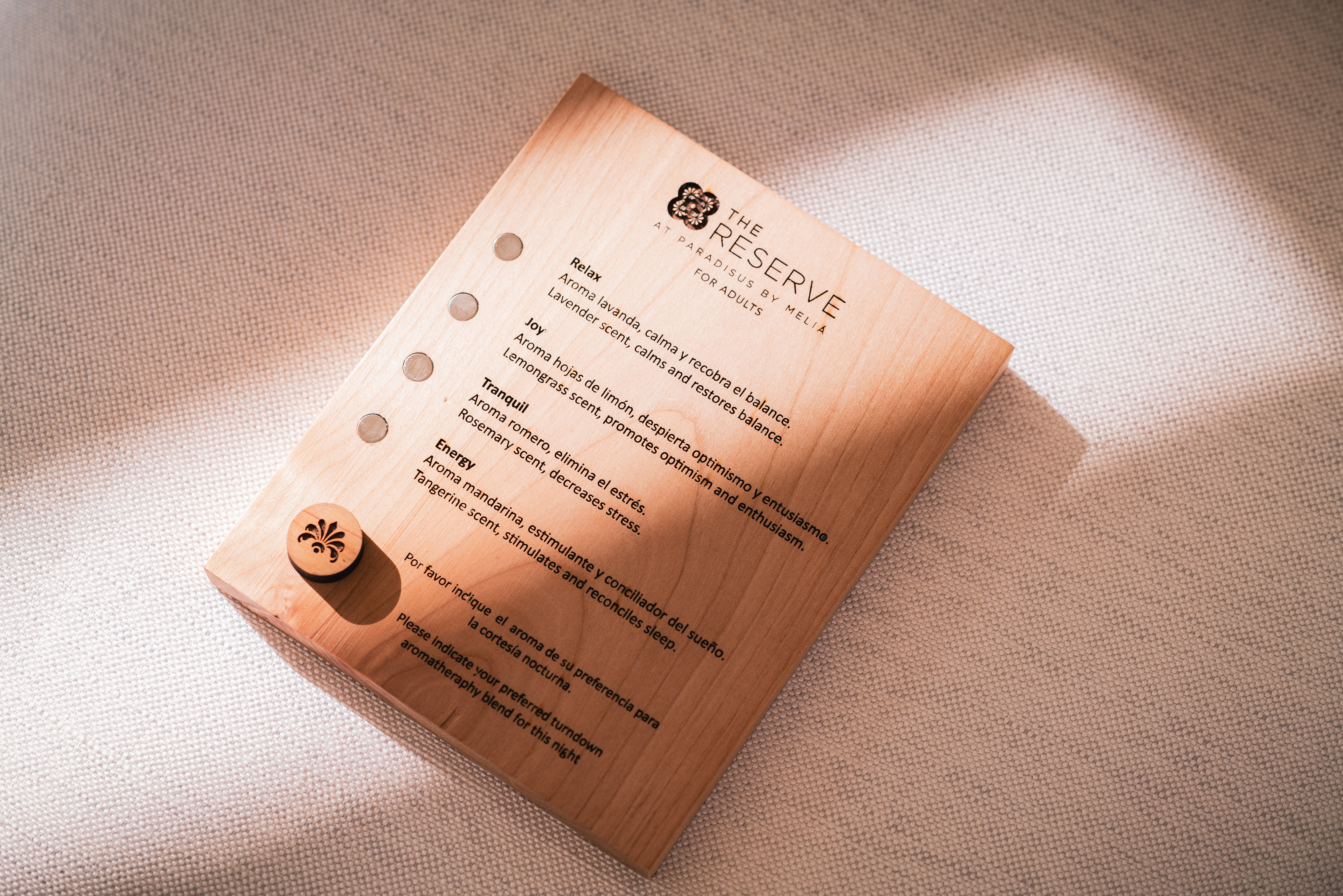 Wooden aromatherapy menu for The Reserve hotel, listing essential oils.