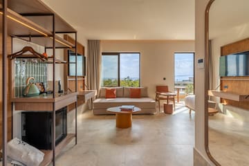 a room with a couch and a fireplace