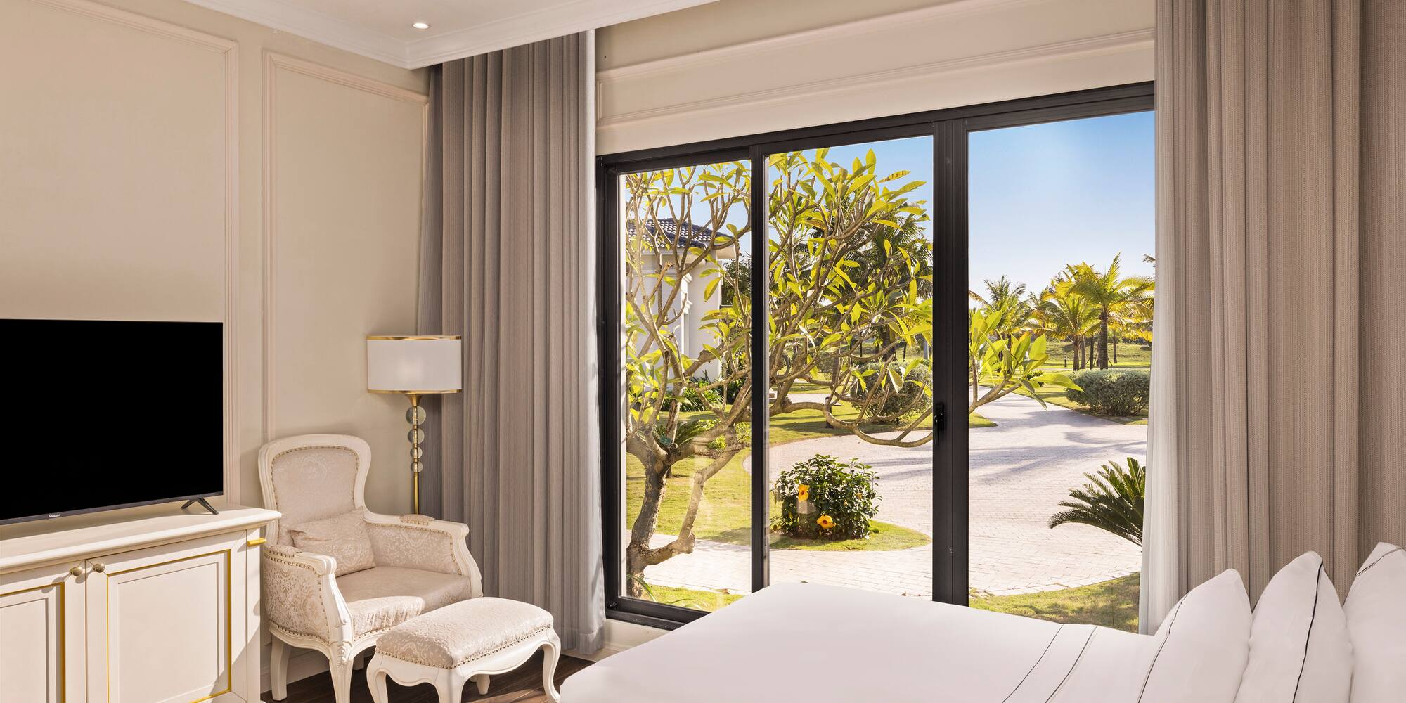 a bedroom with a large window