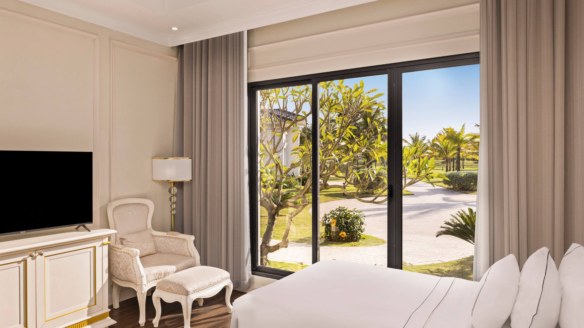 a bedroom with a large window