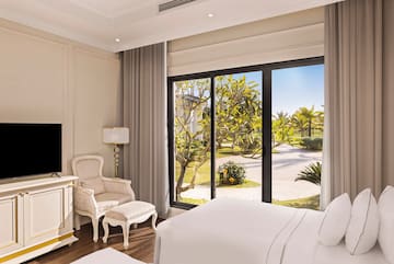 a bedroom with a large window